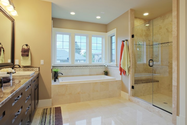 Luxury bathroom with granite countertops and flooring